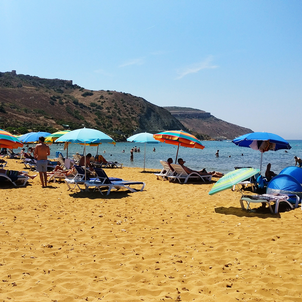 Ir-Ramla I-Hamra (Red Beach) is Gozo’s largest sandy beach with golden-reddish sand - Best beaches in Malta | Aliz’s Wonderland