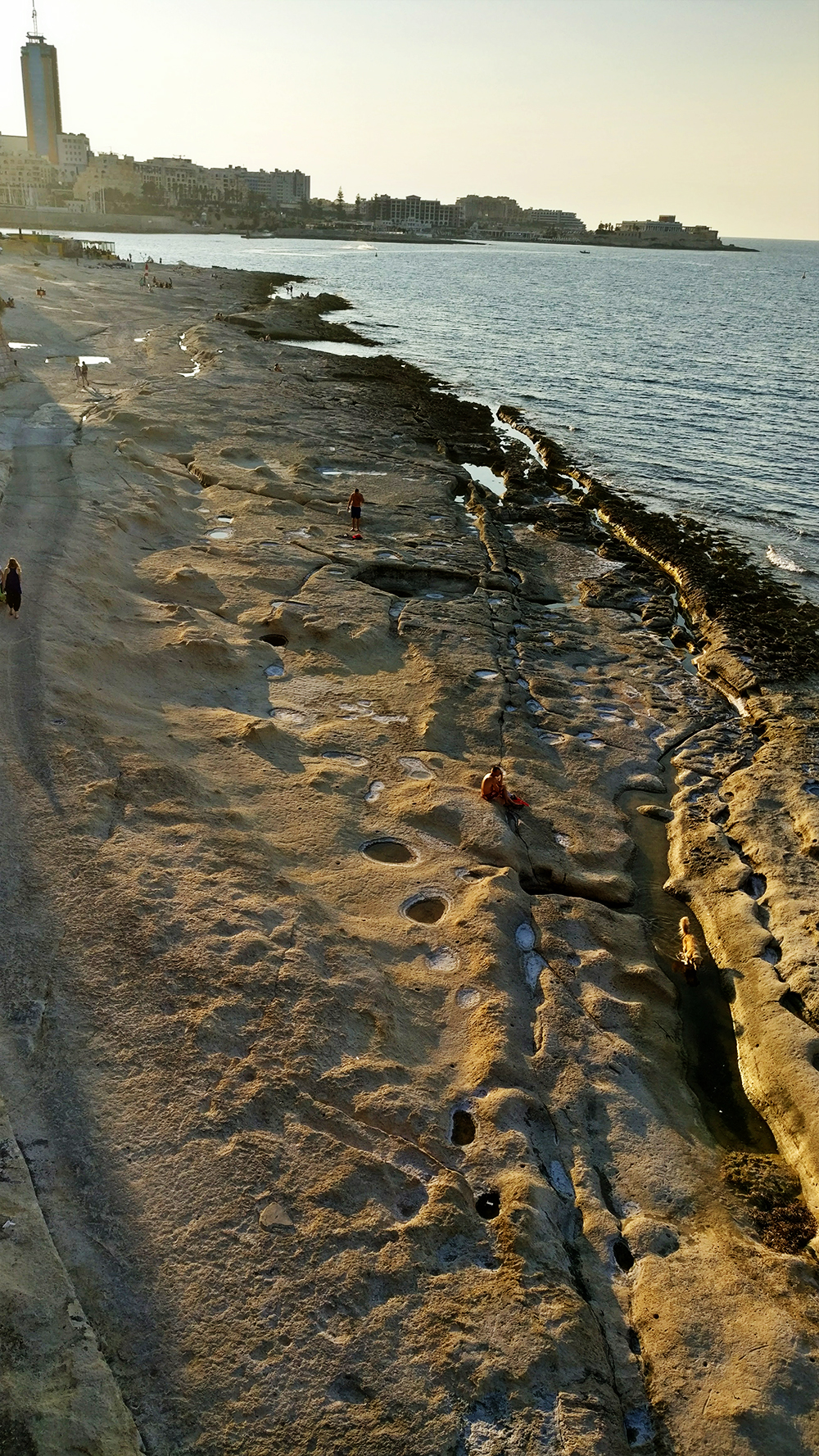 The rocky Fond Ghadir beach with small square pools in Sliema - Best beaches in Malta | Aliz’s Wonderland